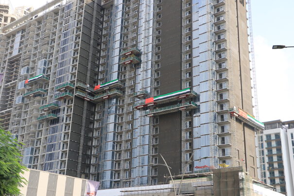 multiple mast climbers on a building